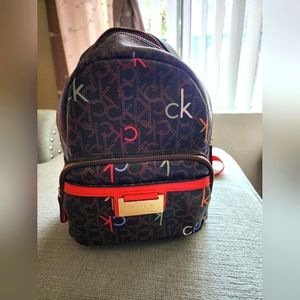Calvin Klein brown with red backpack